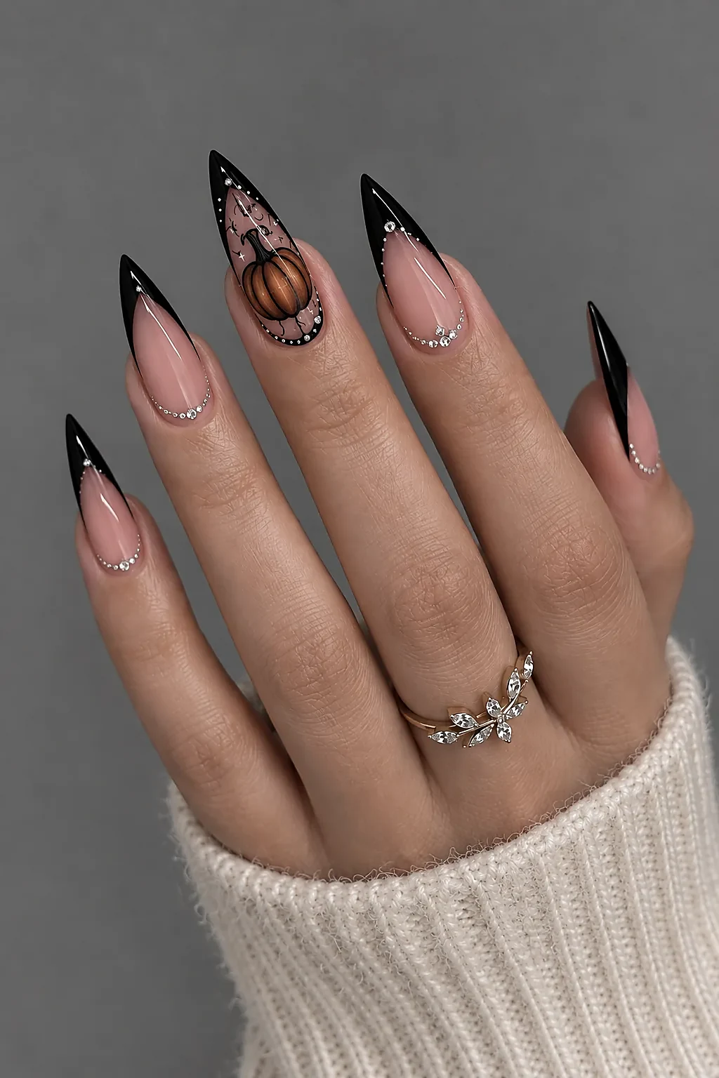 Black nail polish with a gold crescent moon accent nail
